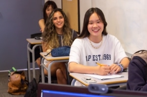 Three students who are in class and excited to Learn English language skills at Global Village in Canada General English Program