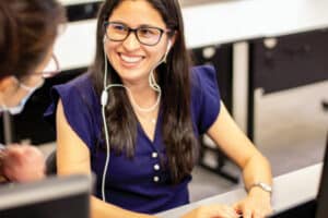 woman student who looks eager to learn English language tips receiving private English lessons at global village in Canada